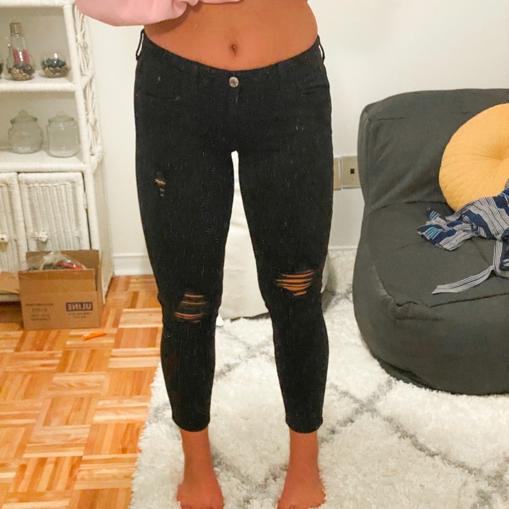 Mid-rise black ripped jeans